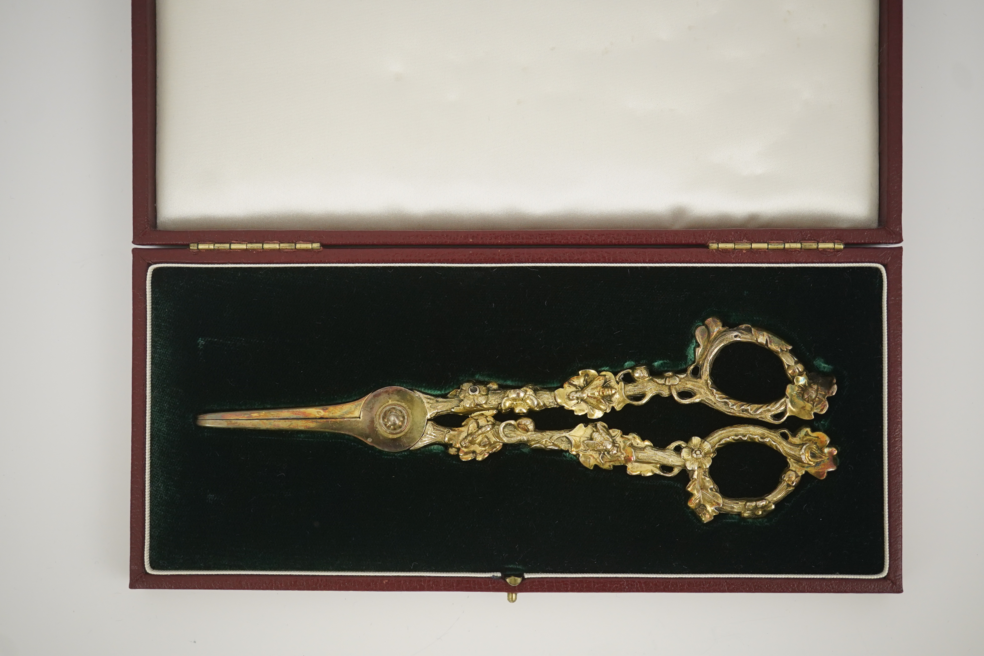 A cased pair of William IV Paul Storr silver gilt grape shears, in later case